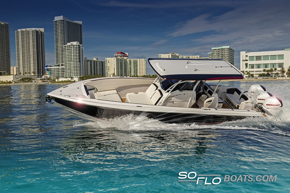 Slide: The Image of 2024 Nor-Tech 340 Sport Center Console boat cruising near city skyline. - 2