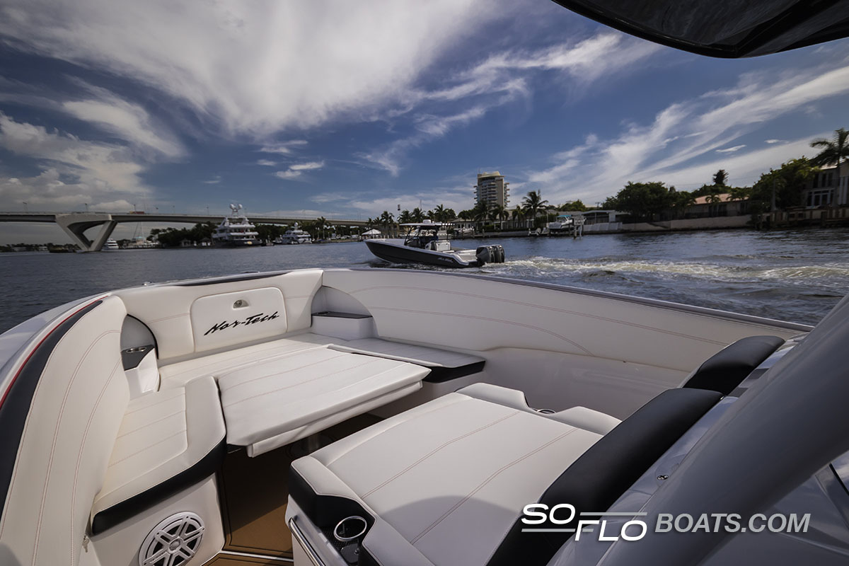 Slide: The Image of 2024 Nor-Tech 340 Sport Center Console boat interior on the water. - 6