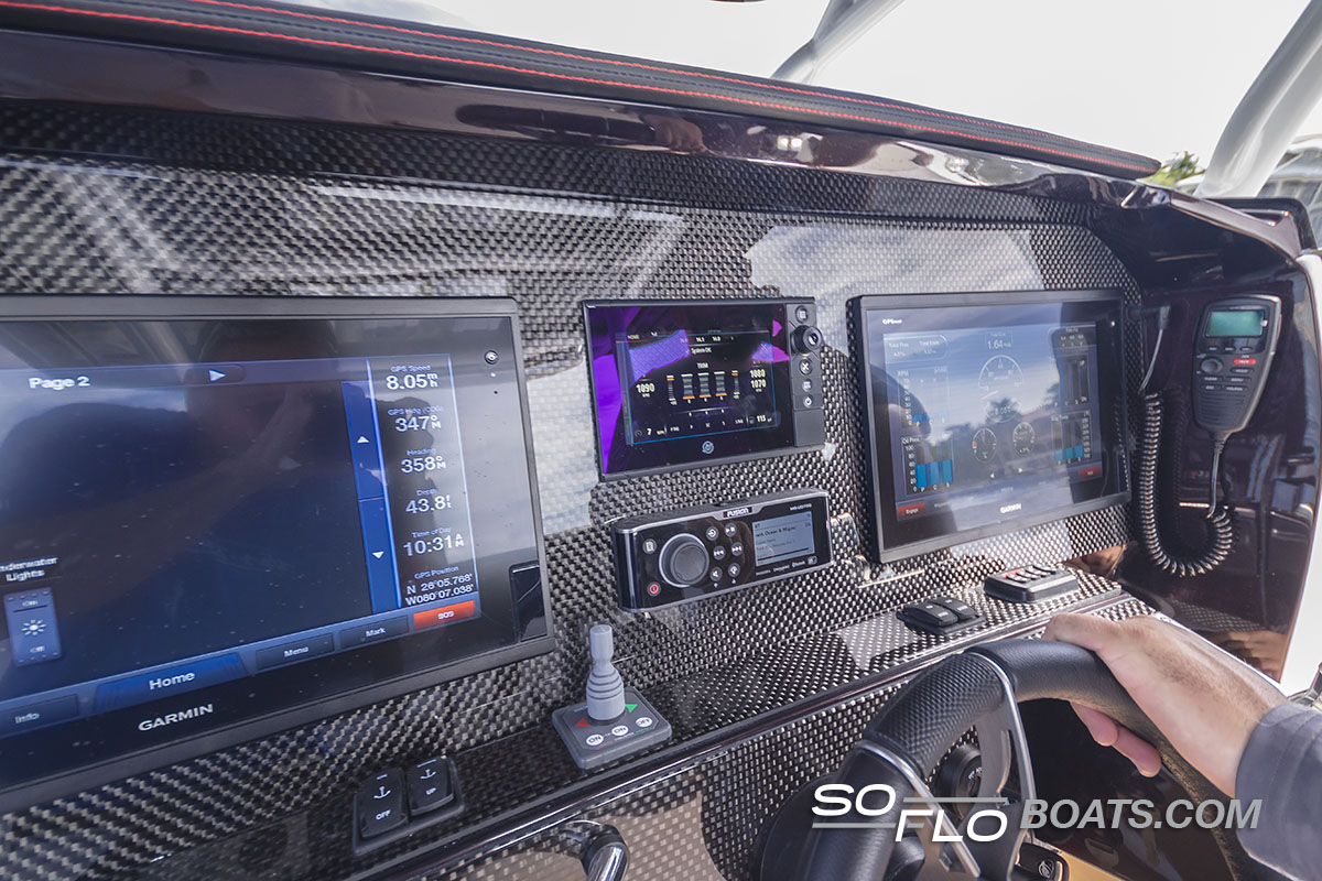 Slide: The Image of 2024 Nor-Tech 340 Sport Center Console dashboard with advanced navigation and control systems. - 9