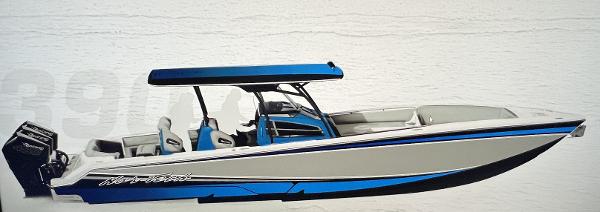 Slide: The Image of 2024 Nor-Tech 390 Center Console boat with blue and white design. - 2