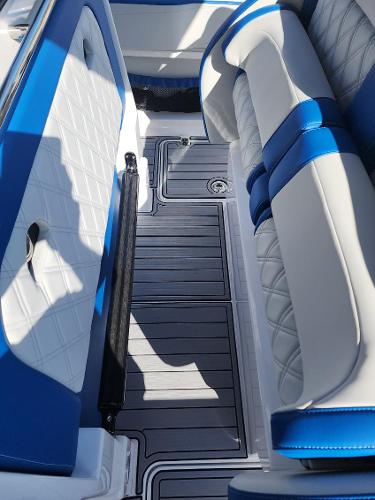 Slide: The Image of 2024 Nor-Tech 400 Supersport interior with blue and white seating. - 2