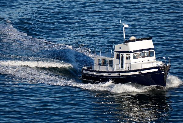 Slide: The Image of 2025 Nordic Tug 44 cruising on open water. - 0