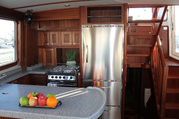 Slide: The Image of Modern kitchen interior of 2025 Nordic Tug 44 with stainless steel appliances. - 1