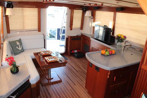 Slide: The Image of Luxurious interior of 2025 Nordic Tug 44 with modern kitchen and cozy dining area. - 2