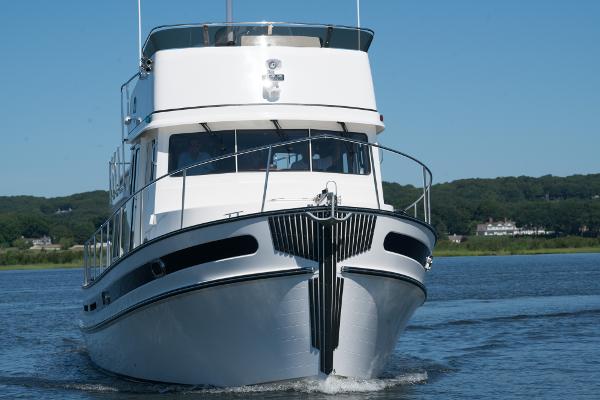 Slide: The Image of 2025 Nordic Tug 44 cruising on a lake. - 7