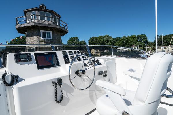 Slide: The Image of 2025 Nordic Tug 44 helm station with modern navigation equipment and comfortable seating. - 8