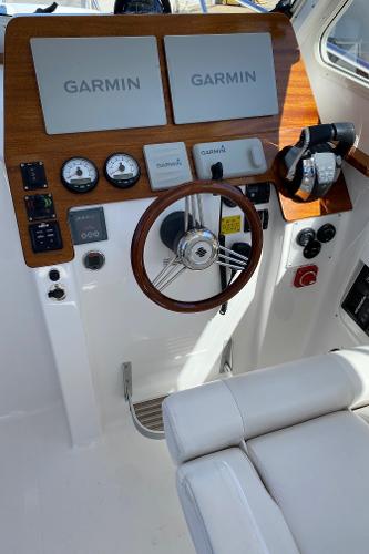Slide: The Image of 2021 NorthCoast 315 HT helm with Garmin electronics and wood accents. - 11