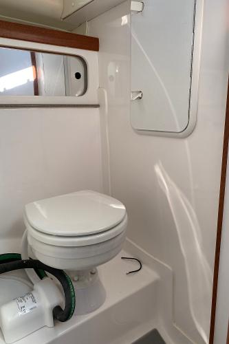 Slide: The Image of 2021 NorthCoast 315 HT boat bathroom with toilet and mirror - 14