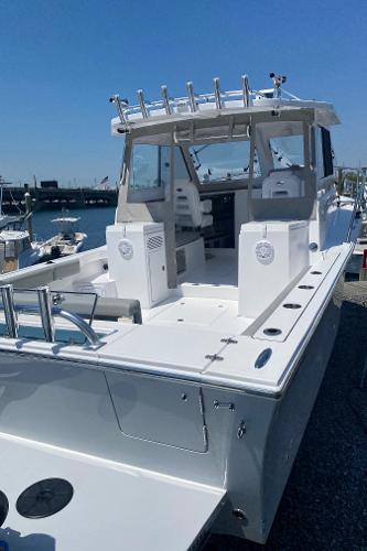 Slide: The Image of 2021 NorthCoast 315 HT boat docked at a marina. - 3