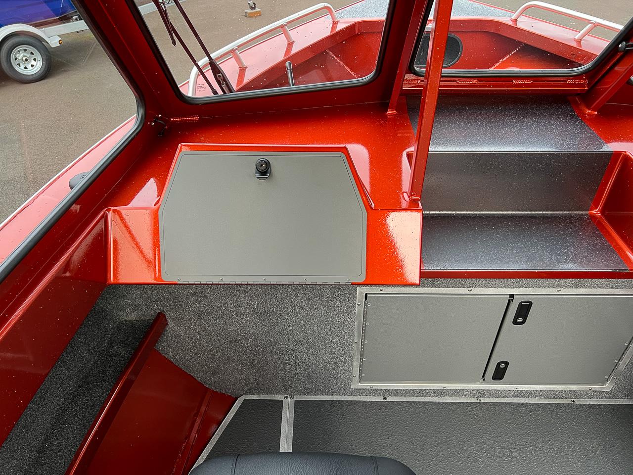 Slide: The Image of Interior of 2024 North River 23 SeaHawk boat with red and gray accents. - 10
