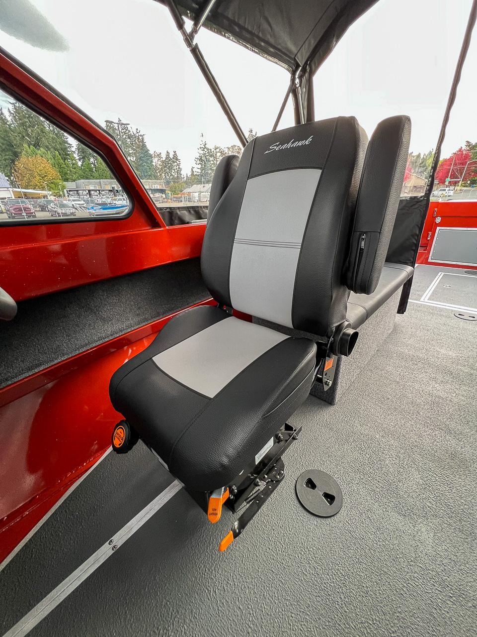 Slide: The Image of Interior seating of 2024 North River 23 SeaHawk boat with black and gray upholstery. - 11