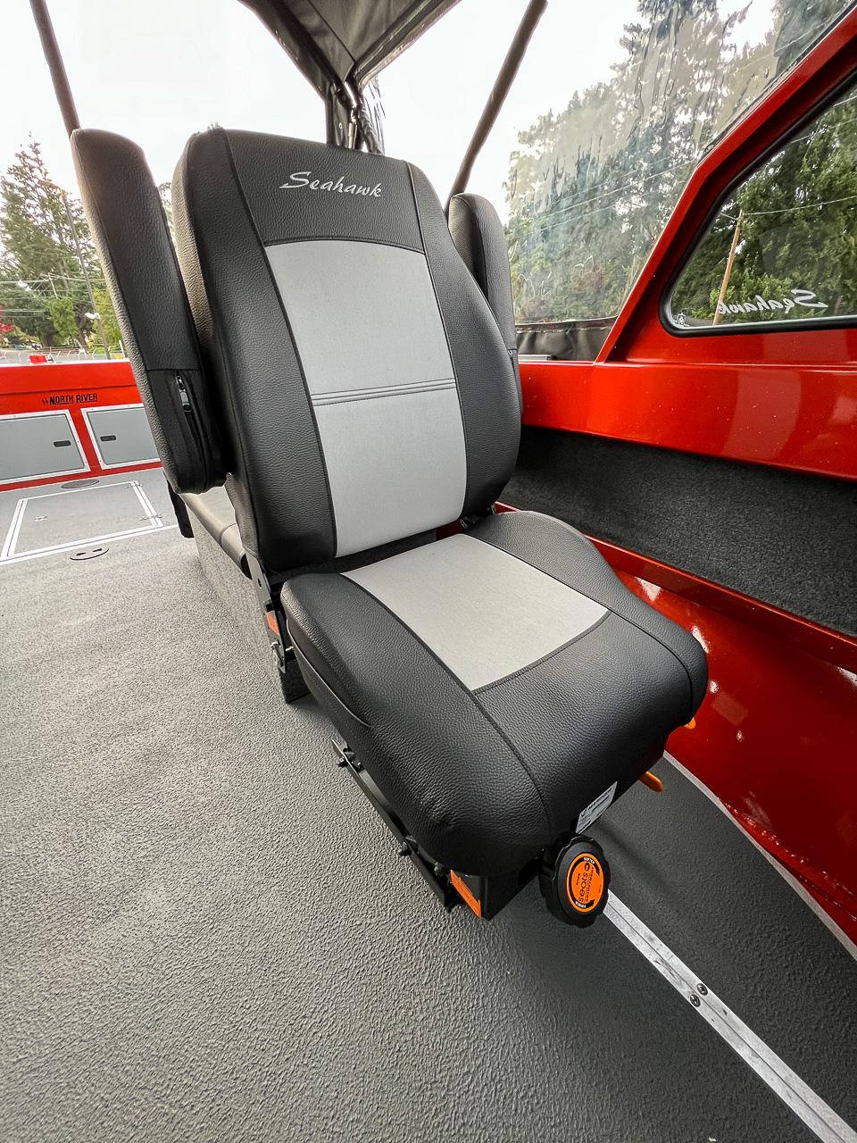 Slide: The Image of 2024 North River 23 SeaHawk boat interior seat with Seahawk branding. - 12