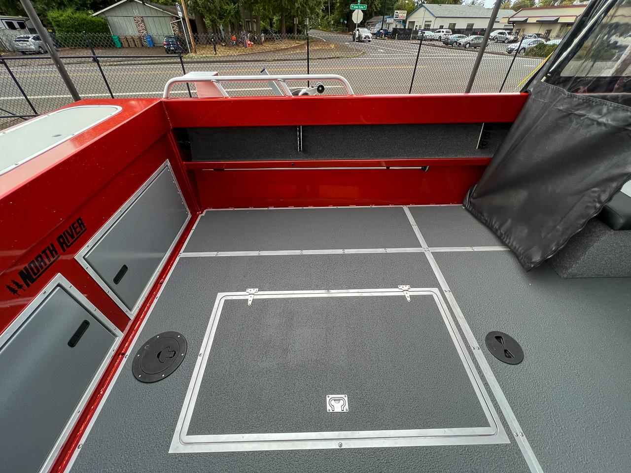 Slide: The Image of 2024 North River 23 SeaHawk boat interior with red and gray detailing. - 15