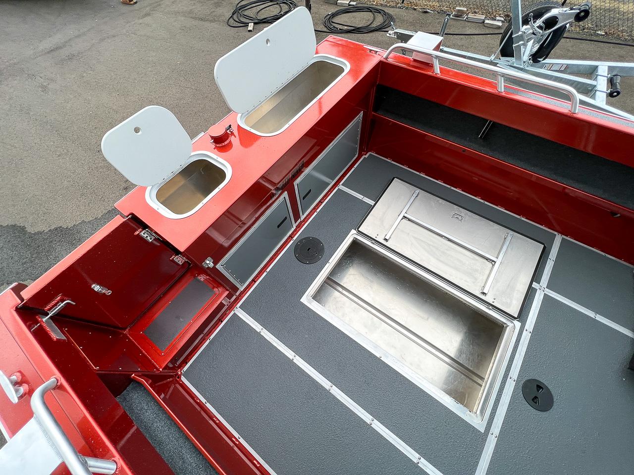 Slide: The Image of 2024 North River 23 SeaHawk boat interior with storage compartments and stainless steel fixtures. - 17