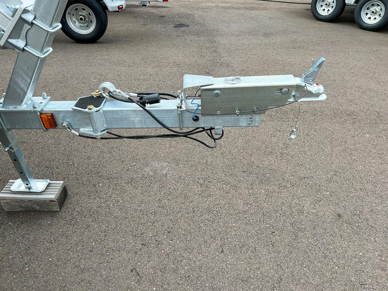 Slide: The Image of Trailer hitch of a 2024 North River 23 SeaHawk boat on asphalt. - 21