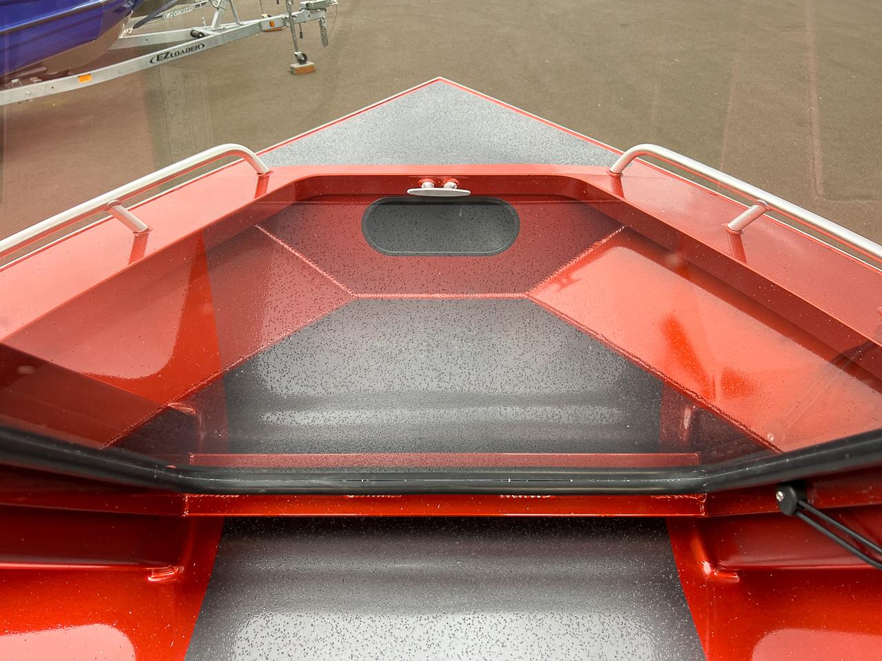 Slide: The Image of 2024 North River 23 SeaHawk boat bow with red and gray detailing. - 8