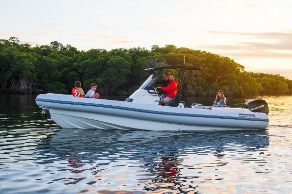 Slide: The Image of 2024 Northstar Orion 8 boat cruising on a calm lake with passengers. - 16