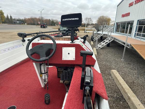 Slide: The Image of 1995 Northwood 1675 Fisherman boat with red interior and Humminbird fish finder. - 1