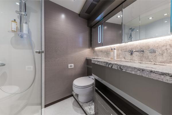 Slide: The Image of Luxurious bathroom in 2023 Ocean Alexander 35R yacht with modern fixtures and marble countertop. - 14