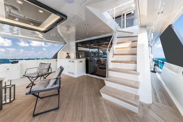 Slide: The Image of Luxury yacht Ocean Alexander 35R 2023 model, featuring elegant outdoor seating and staircase. - 15