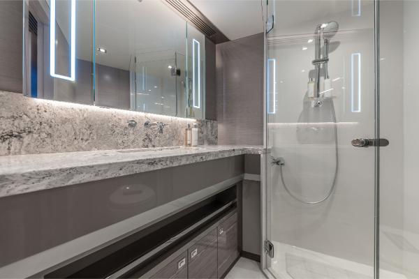 Slide: The Image of Luxury bathroom in 2023 Ocean Alexander 35R yacht with modern fixtures and marble countertop. - 18
