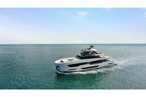Slide: The Image of 2023 Ocean Alexander 35R luxury yacht cruising on open water. - 2