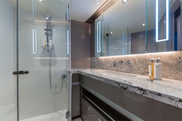 Slide: The Image of Modern bathroom in 2023 Ocean Alexander 35R yacht with glass shower and marble countertop. - 20