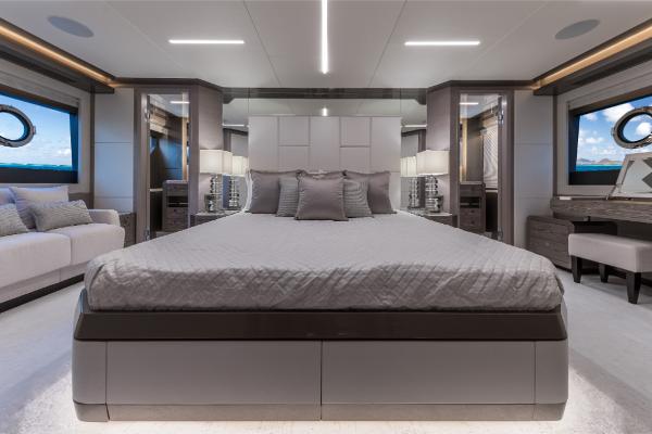Slide: The Image of Luxurious master bedroom on the 2023 Ocean Alexander 35R yacht, featuring modern design and ocean views. - 25