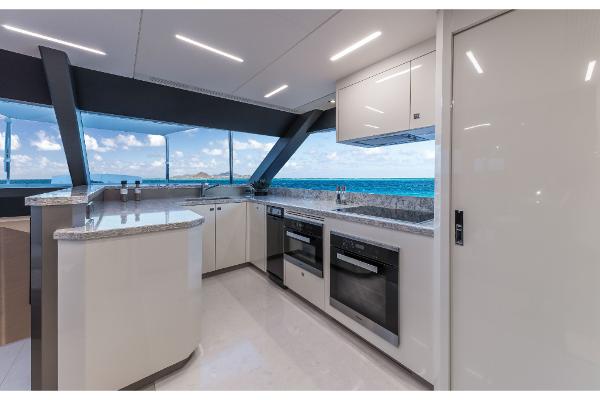 Slide: The Image of Modern kitchen interior on the 2023 Ocean Alexander 35R yacht with ocean view. - 27