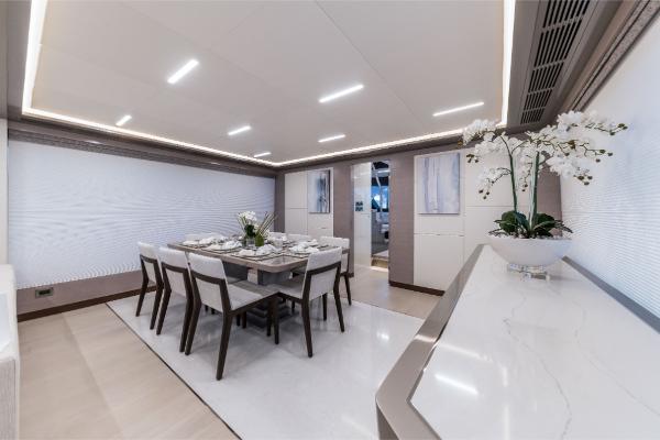 Slide: The Image of Luxurious dining area on the 2023 Ocean Alexander 35R yacht, featuring modern decor and elegant furnishings. - 29