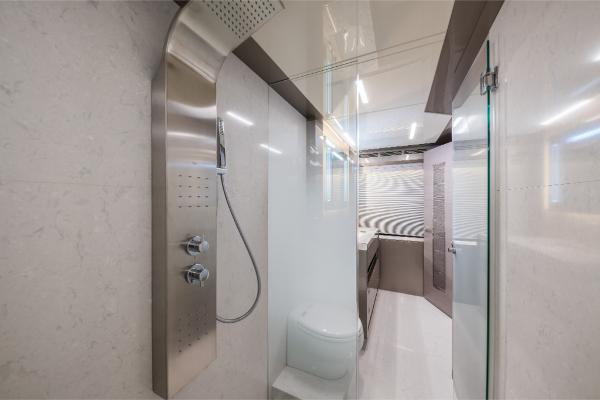 Slide: The Image of Modern bathroom on the 2023 Ocean Alexander 35R yacht with sleek shower and toilet. - 38