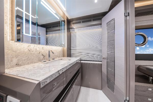 Slide: The Image of Luxurious bathroom in 2023 Ocean Alexander 35R yacht with modern fixtures and marble countertop. - 39