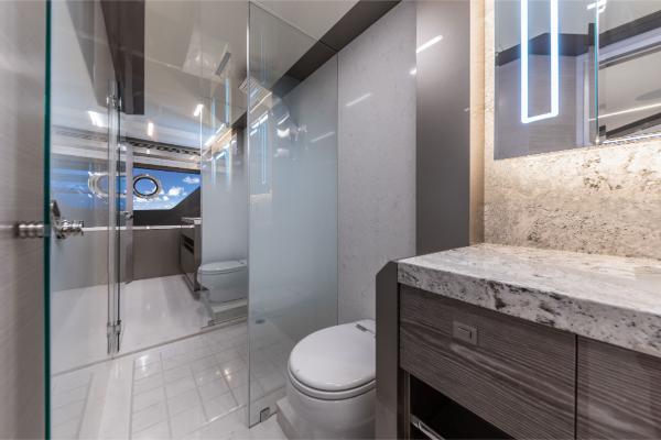 Slide: The Image of Luxury bathroom on the 2023 Ocean Alexander 35R yacht with modern fixtures and glass shower. - 40