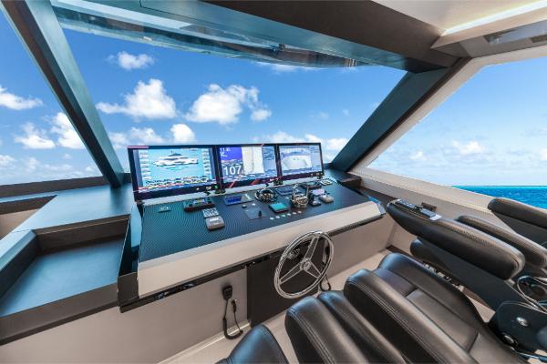 Slide: The Image of Ocean Alexander 35R 2023 yacht helm with advanced navigation systems and ocean view. - 46