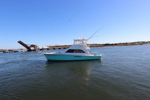 Slide: The Image of 1990 Ocean Yachts 48 Super Sport on calm waters. - 1