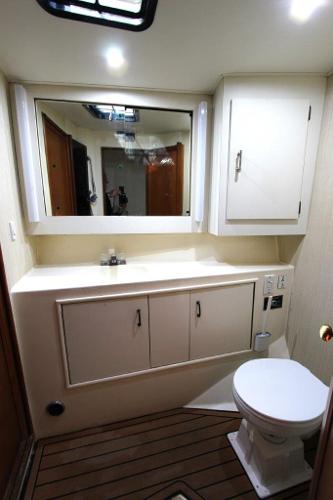 Slide: The Image of Bathroom interior of a 1990 Ocean Yachts 48 Super Sport with wooden flooring. - 24