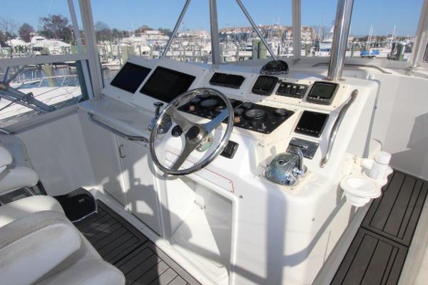 Slide: The Image of Cockpit of 1990 Ocean Yachts 48 Super Sport with modern navigation equipment. - 27