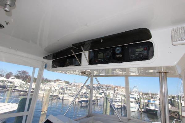 Slide: The Image of 1990 Ocean Yachts 48 Super Sport helm with marina view - 29