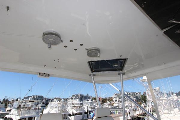 Slide: The Image of 1990 Ocean Yachts 48 Super Sport flybridge ceiling with hatch and marina view. - 30