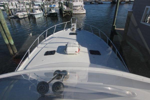 Slide: The Image of 1990 Ocean Yachts 48 Super Sport bow view at marina. - 32