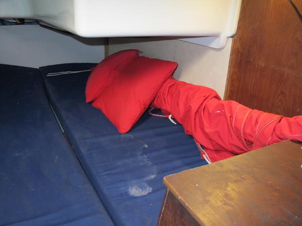 Slide: The Image of Interior cabin of 1987 O'Day 322 sailboat with blue mattress and red pillow. - 32