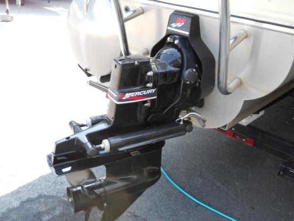 Slide: The Image of 2004 Odyssey Millennium 2502M boat with Mercury outboard motor. - 15