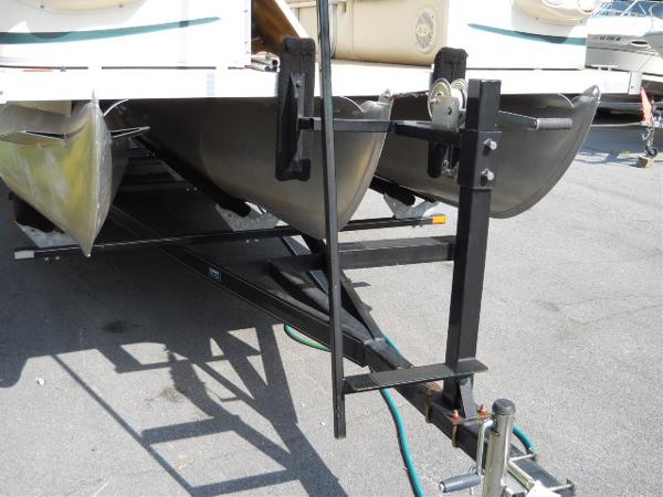 Slide: The Image of 2004 Odyssey Millennium 2502M pontoon boat on trailer. - 18
