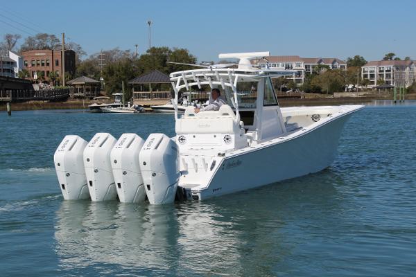 Slide: The Image of 2021 Onslow Bay 41 Tournament Edition boat with four outboard engines on the water. - 10