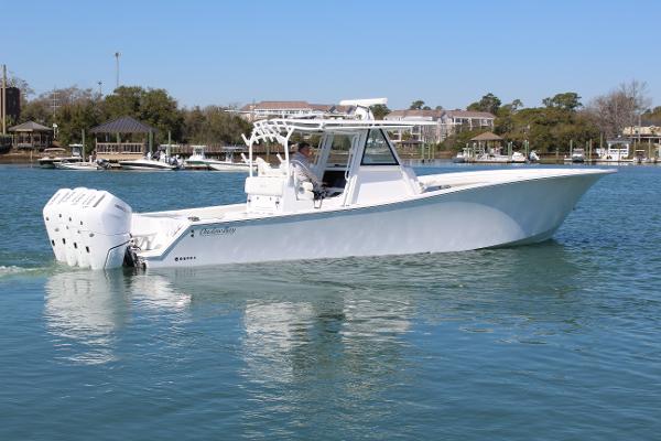 Slide: The Image of 2021 Onslow Bay 41 Tournament Edition boat on calm water. - 11