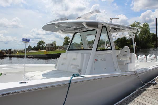 Slide: The Image of 2021 Onslow Bay 41 Tournament Edition boat docked by the water. - 21