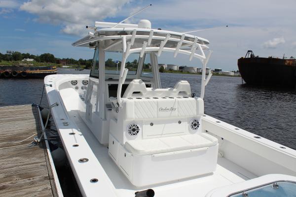 Slide: The Image of 2021 Onslow Bay 41 Tournament Edition boat docked by the water. - 24