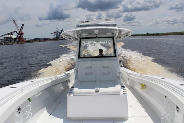 Slide: The Image of 2021 Onslow Bay 41 Tournament Edition boat cruising on water. - 28