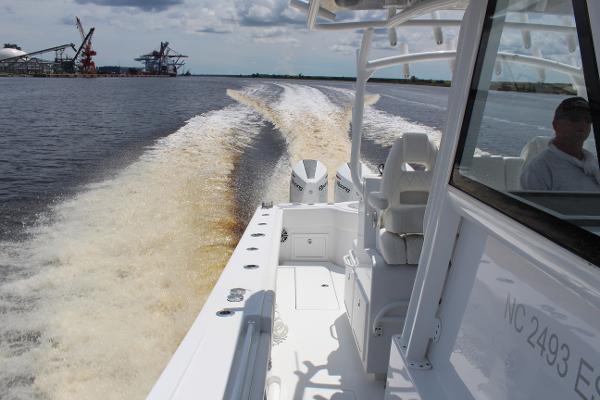 Slide: The Image of 2021 Onslow Bay 41 Tournament Edition boat cruising on water, leaving a wake. - 29