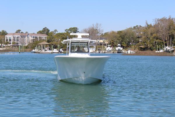 Slide: The Image of 2021 Onslow Bay 41 Tournament Edition boat on calm water. - 3